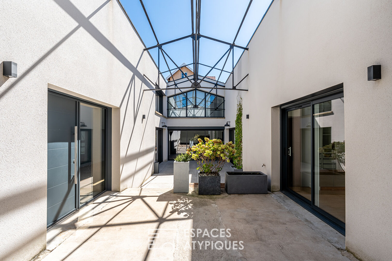 Industrial loft-style house with patio