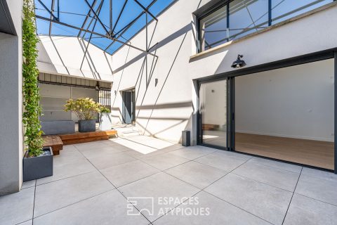 Industrial loft-style house with patio