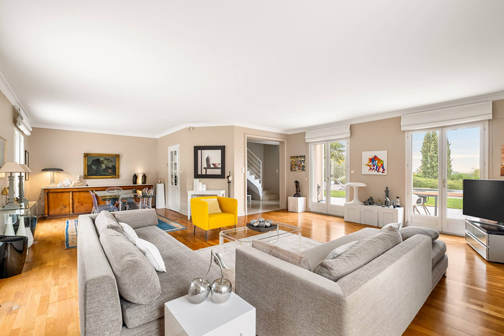 Bright house with swimming pool and tennis court in a green setting with no overlooking neighbors.