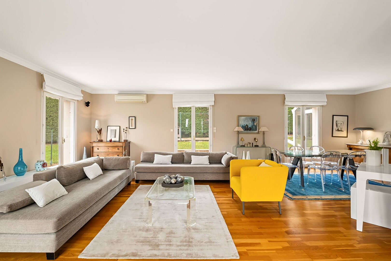 Bright house with swimming pool and tennis court in a green setting with no overlooking neighbors.