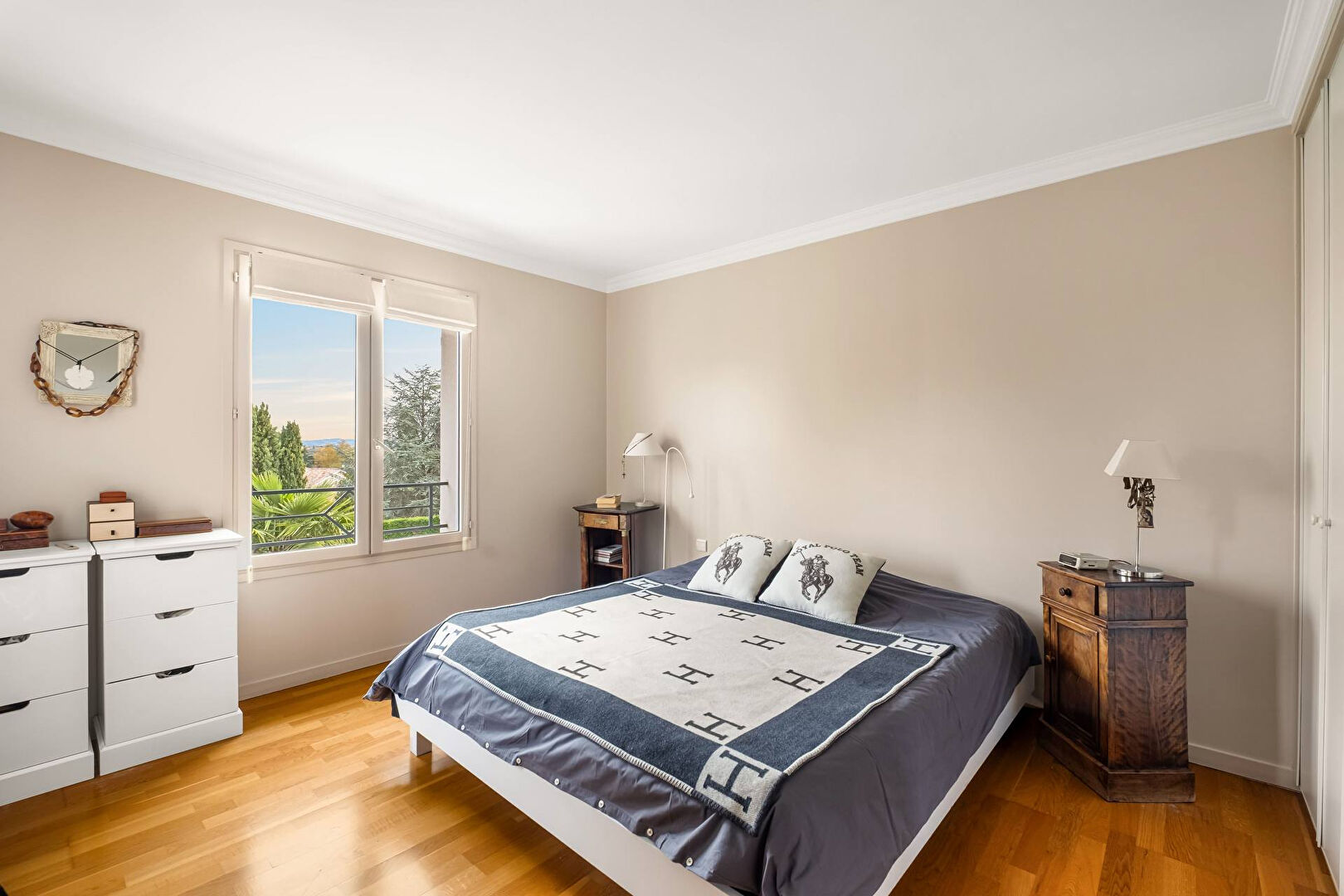 Bright house with swimming pool and tennis court in a green setting with no overlooking neighbors.