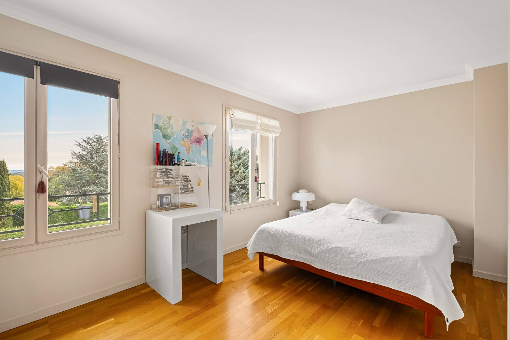 Bright house with swimming pool and tennis court in a green setting with no overlooking neighbors.