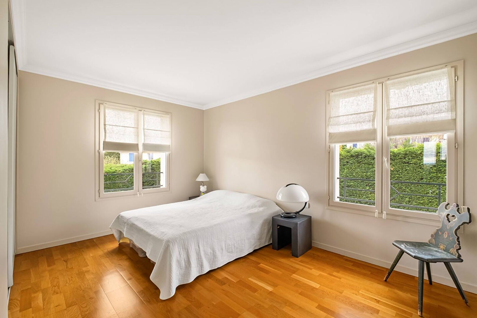 Bright house with swimming pool and tennis court in a green setting with no overlooking neighbors.