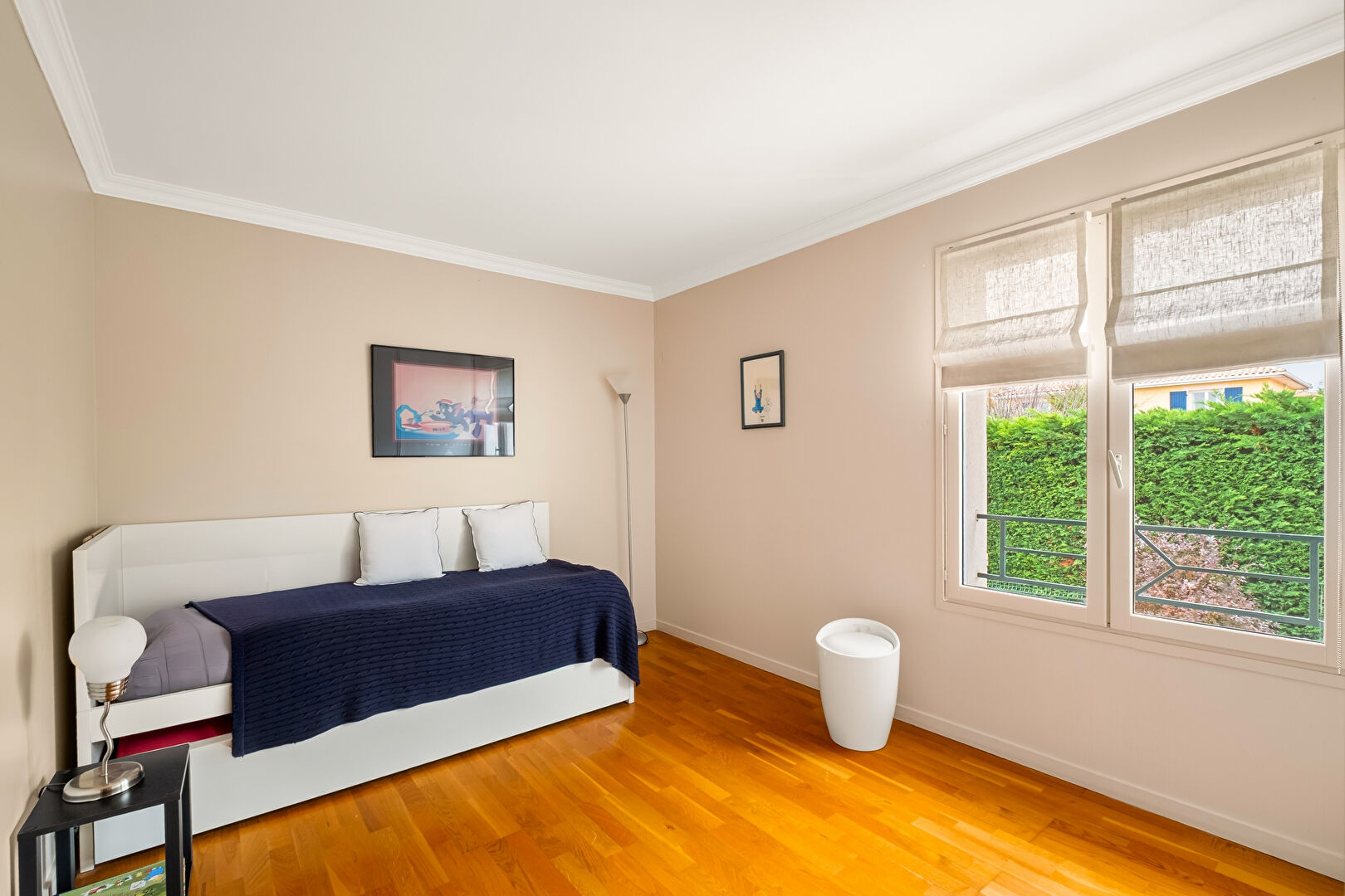 Bright house with swimming pool and tennis court in a green setting with no overlooking neighbors.