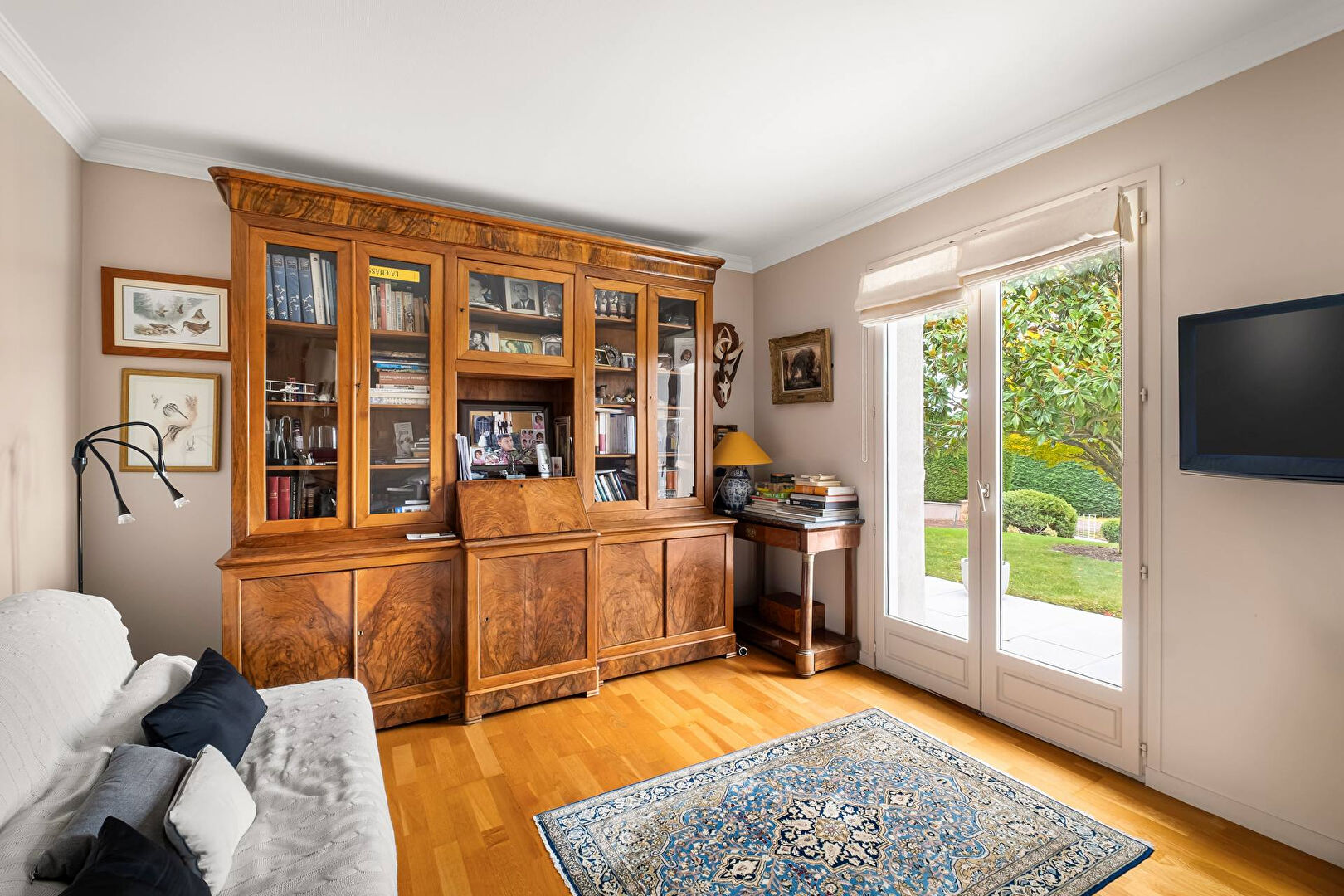 Bright house with swimming pool and tennis court in a green setting with no overlooking neighbors.