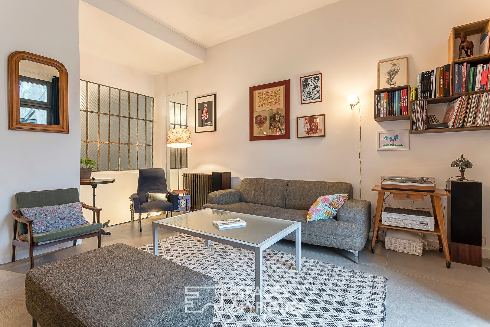 Appartement en rez de jardin esprit maison avec véranda