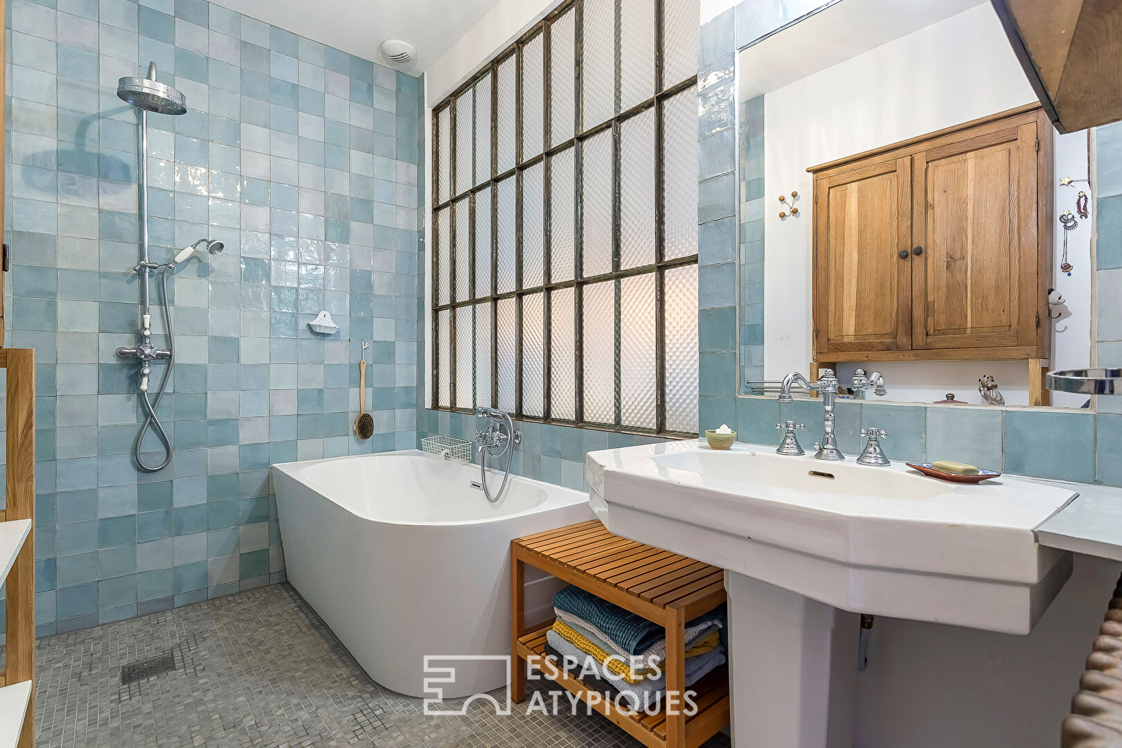 Appartement en rez de jardin esprit maison avec véranda