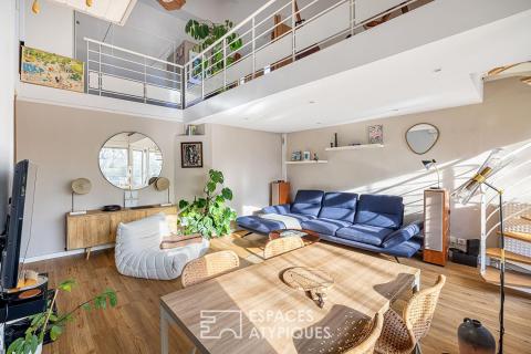 Double hauteur et terrasses en dernier étage à deux pas du Rhône