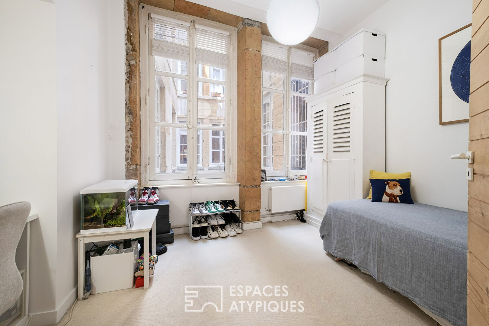 Character apartment in double destination facing the Saint-Nizier church