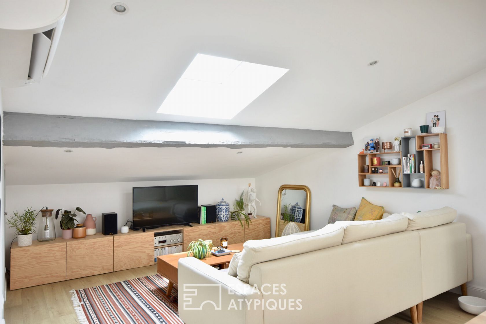 Appartement avec patio sous les toits