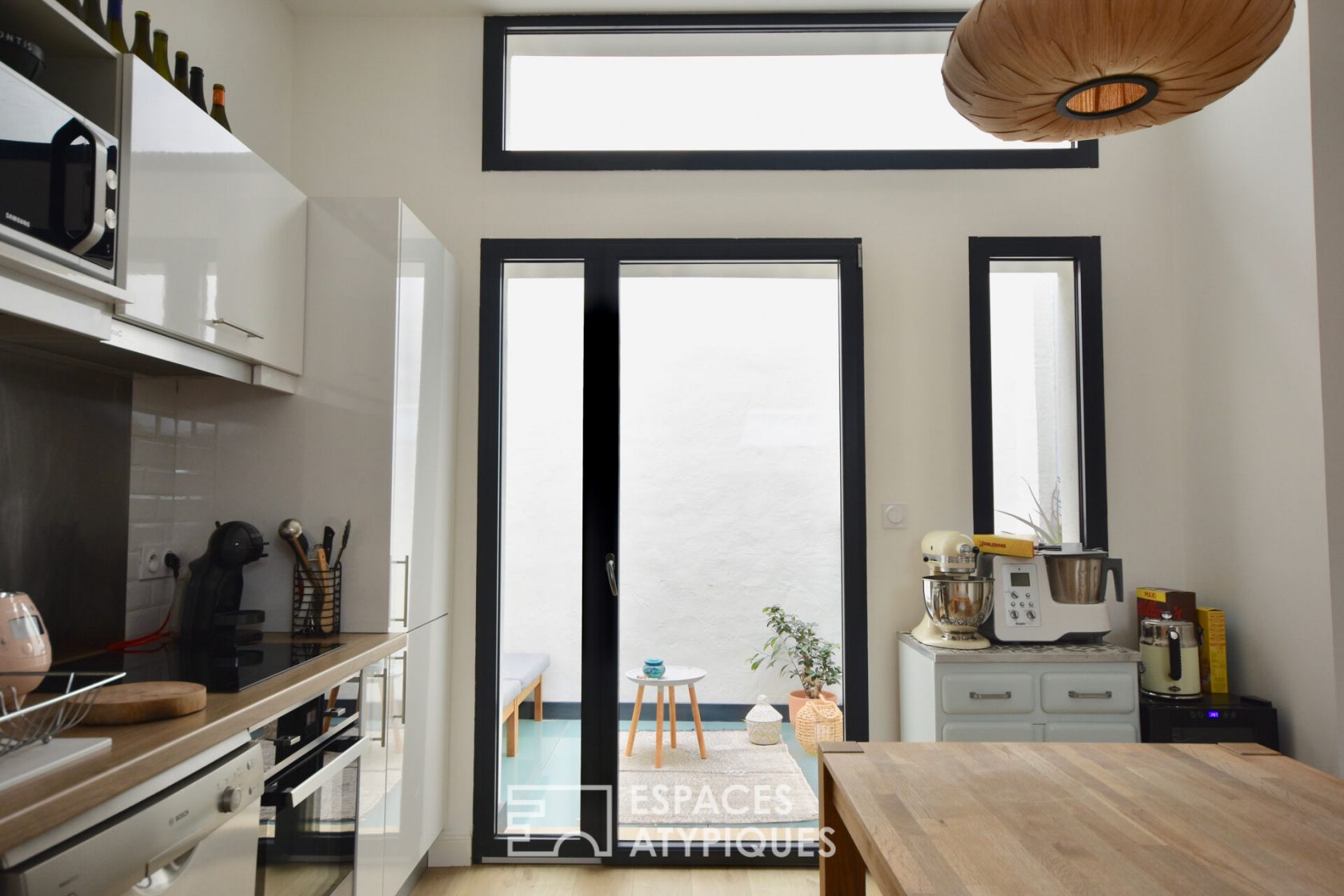 Appartement avec patio sous les toits