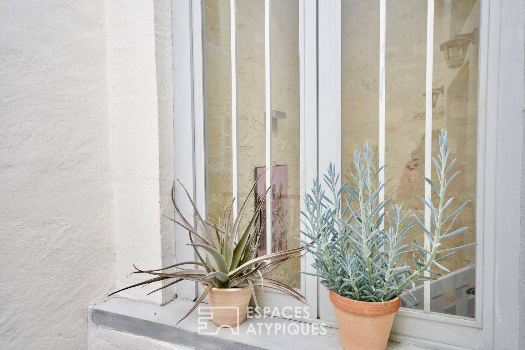 Appartement avec patio sous les toits
