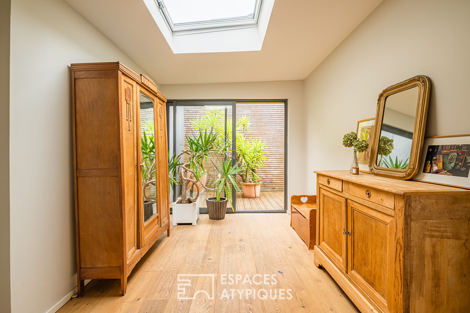 Former car garage transformed with terrace and garage