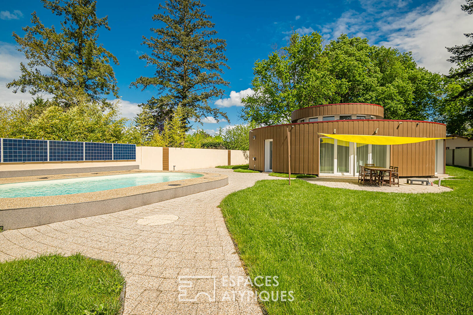 The cylindrical house with garden and swimming pool