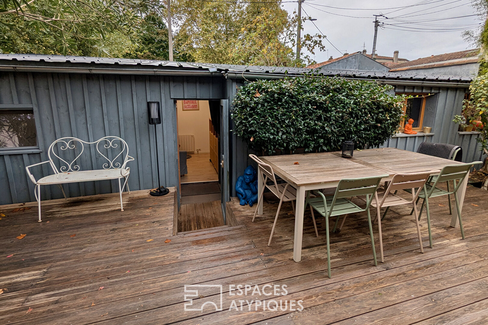 Shop-style house with outdoor space, outbuilding and garage