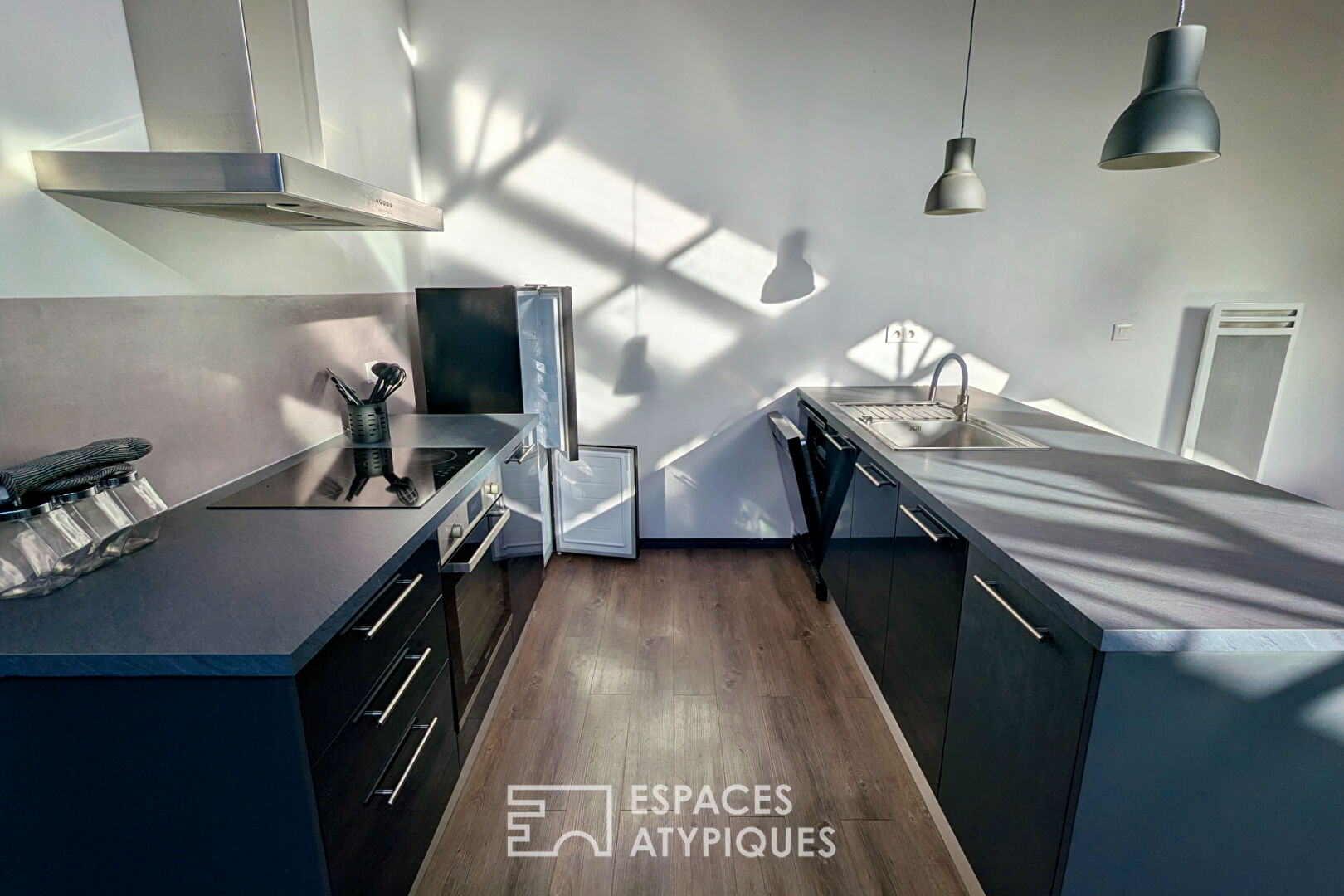 Loft industriel meublé en face du Parc Rivière