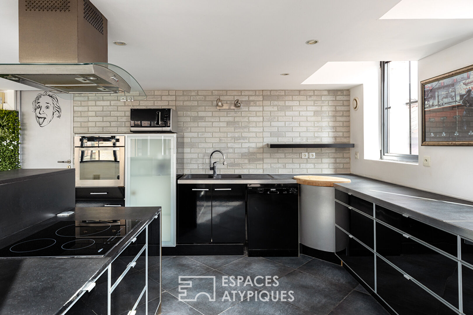 Loft industriel avec rooftop vues sur les toits de Roubaix
