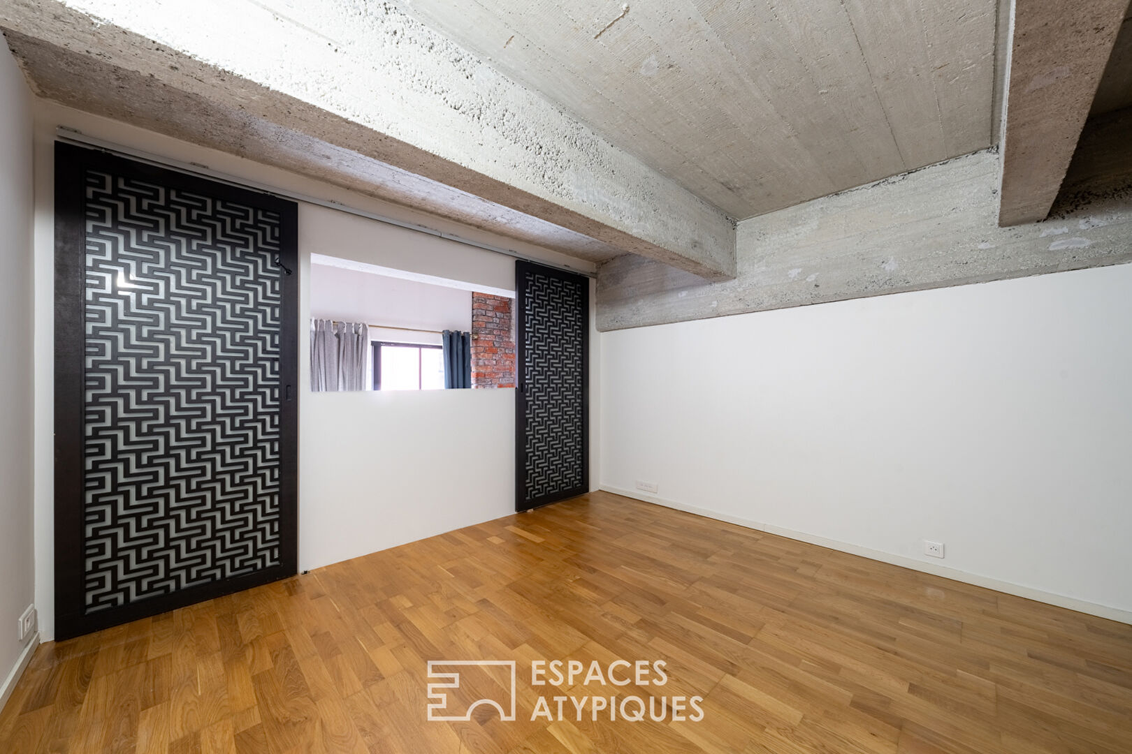 Loft aux volumes spectaculaires et lumière omniprésente