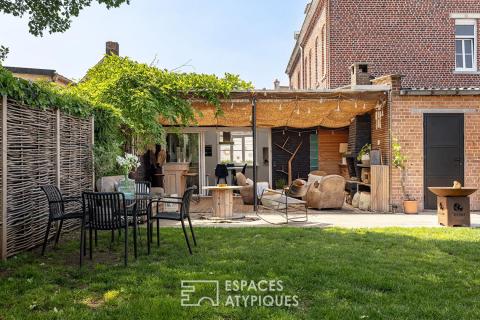 Family home with multiple volumes and a garden