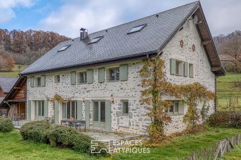 Renovated farmhouse with swimming pool and grounds bordered by a stream