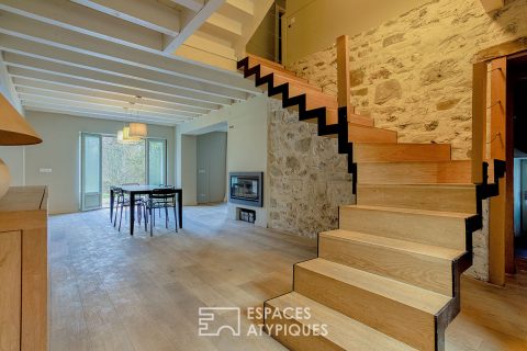 Renovated farmhouse with swimming pool and grounds bordered by a stream