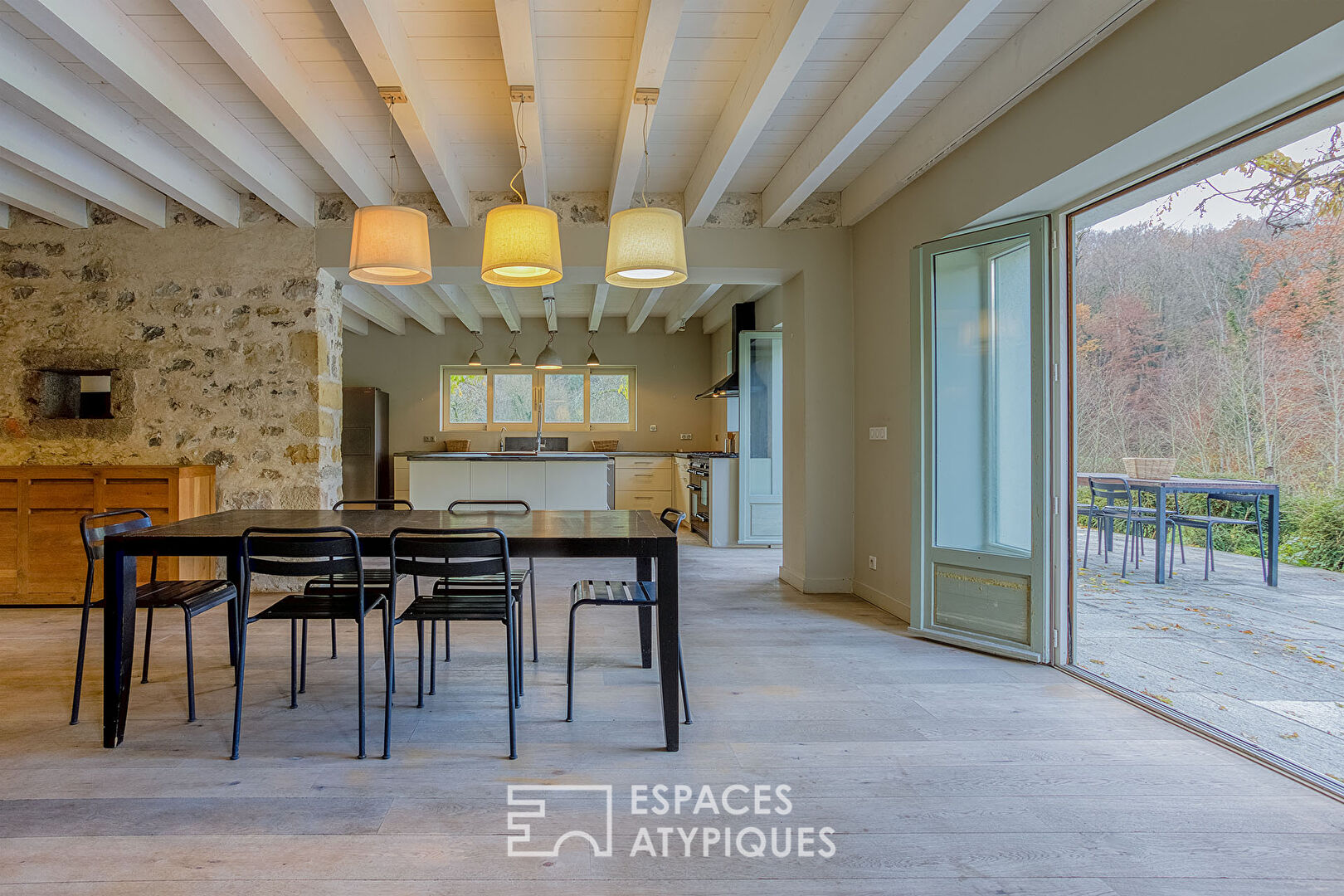 Renovated farmhouse with swimming pool and grounds bordered by a stream