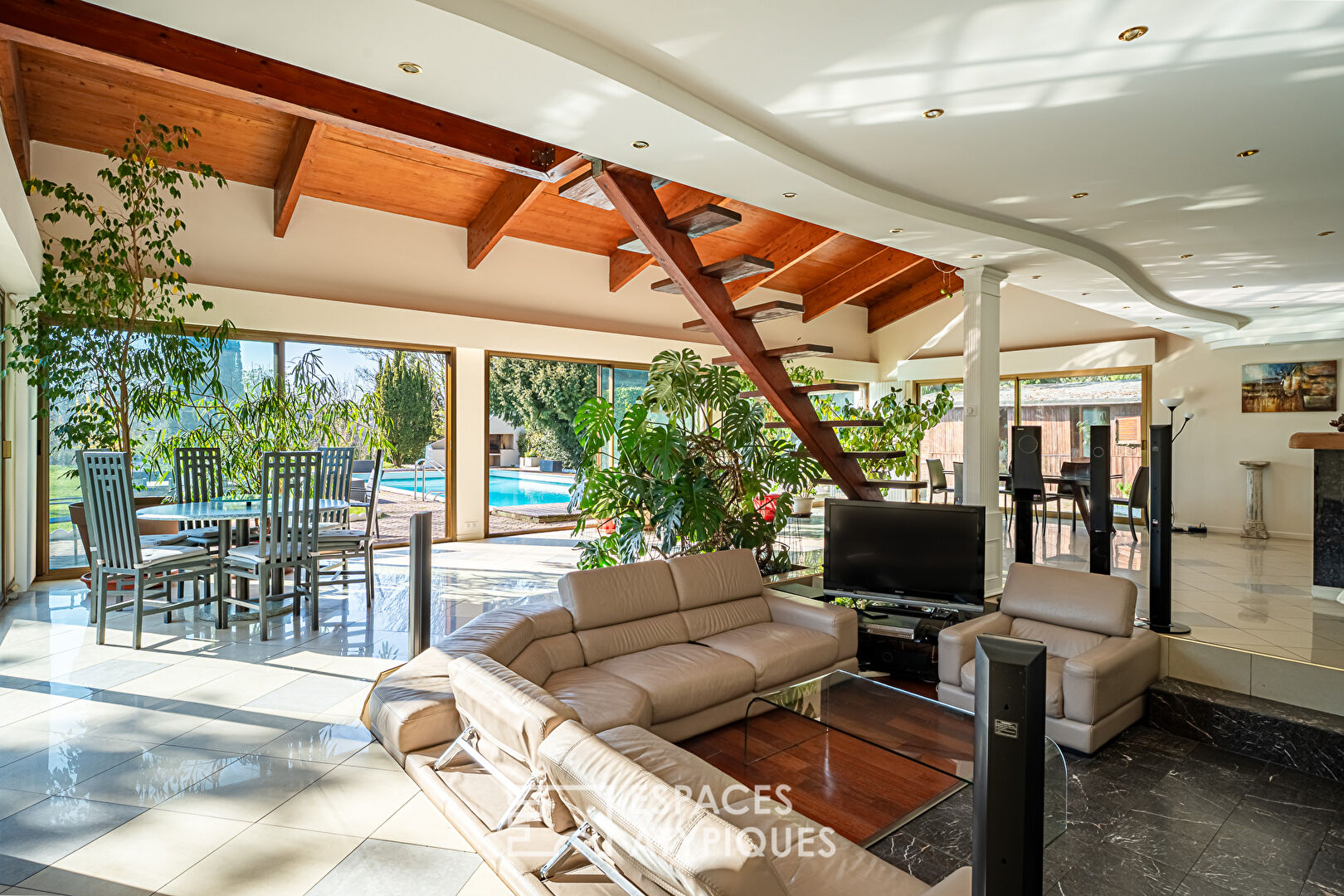 Multifaceted architect-designed house with open views, swimming pool and outbuildings