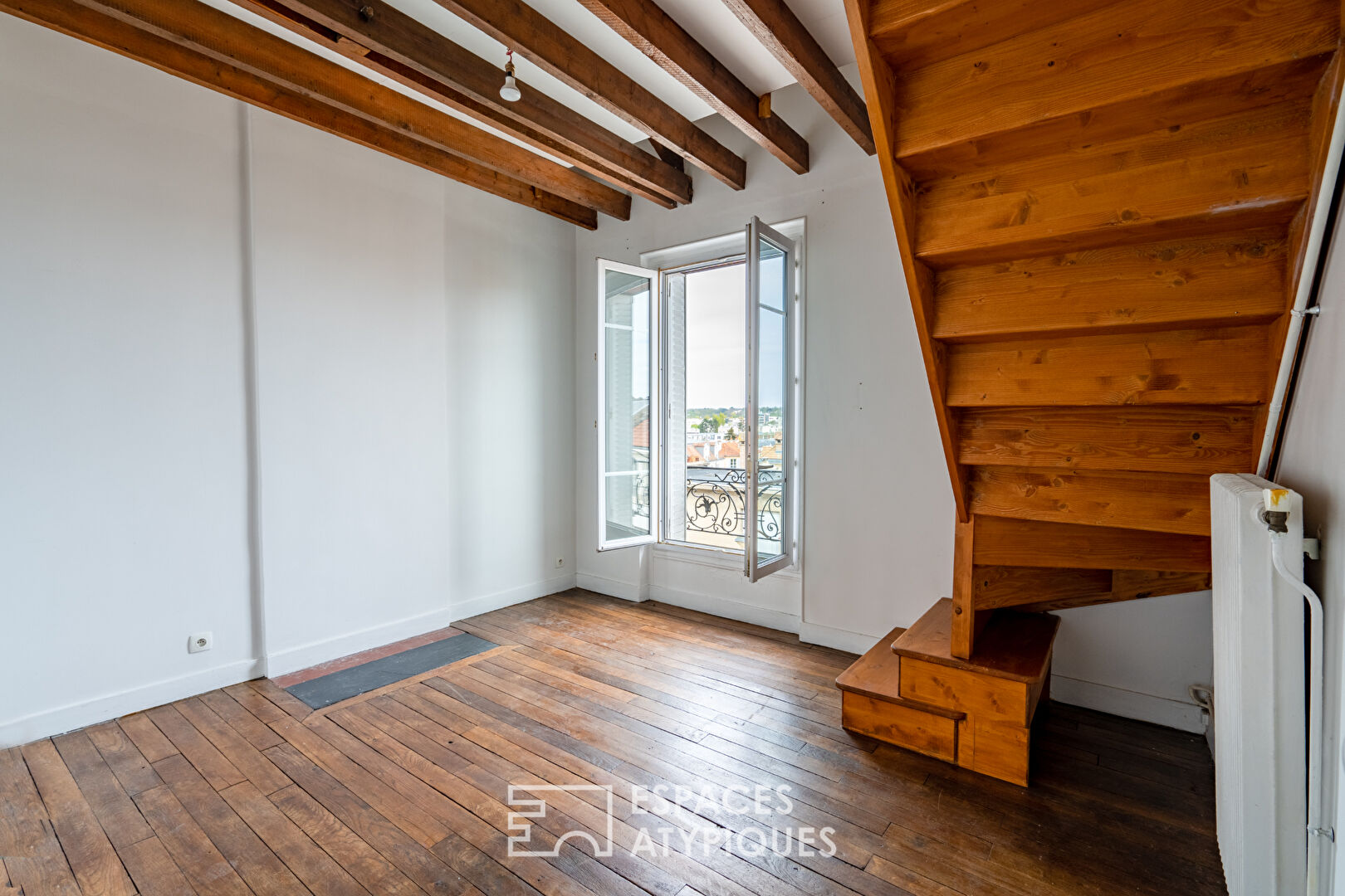 Duplex atypique en dernier étage