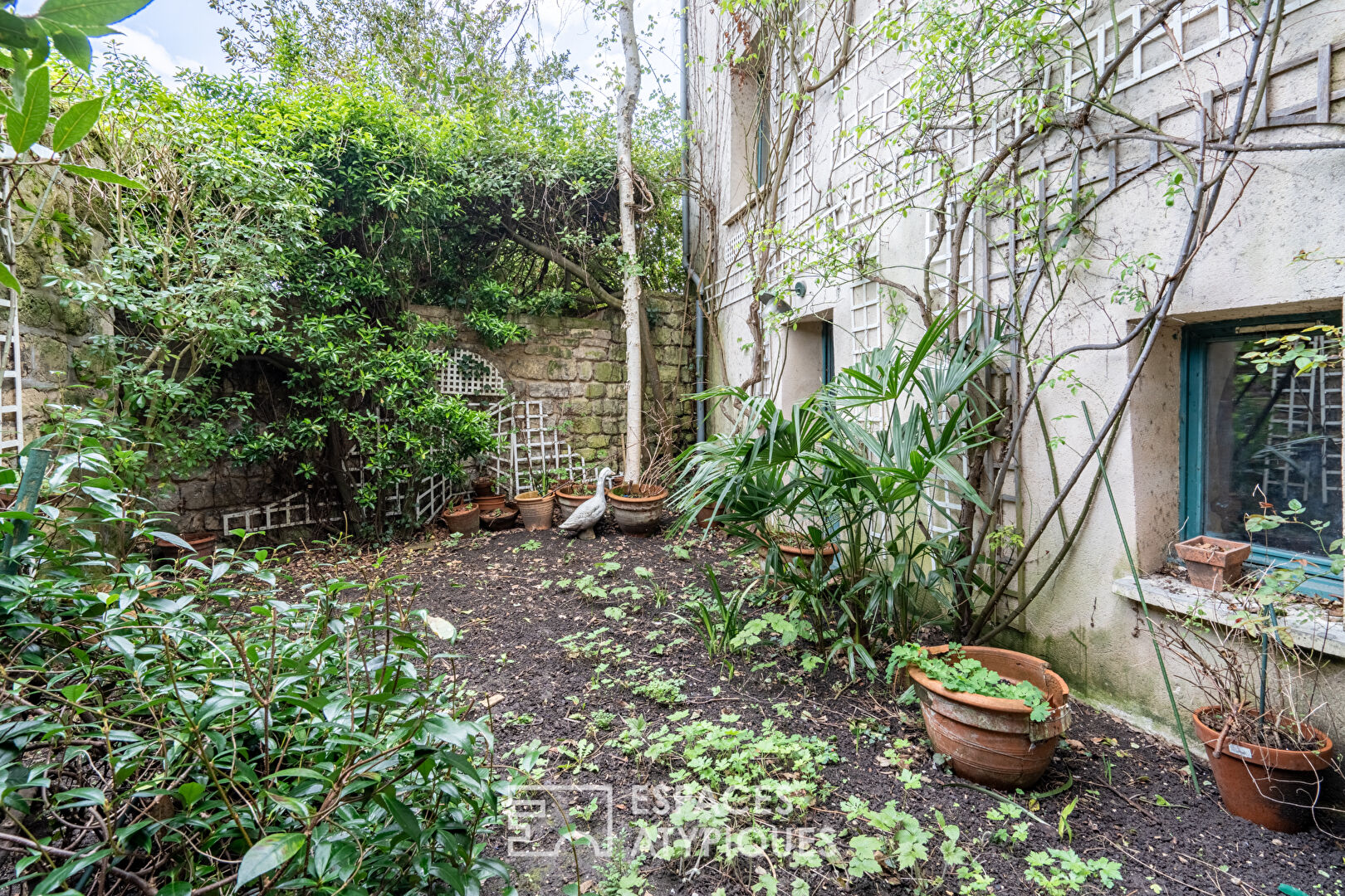 Maison ancienne et jardin avec vue exceptionnelle sur les bords de Seine et Paris.