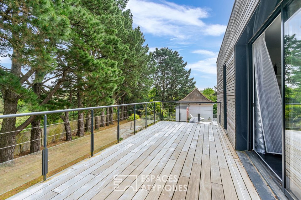 Maison d'exception et son jardin luxuriant