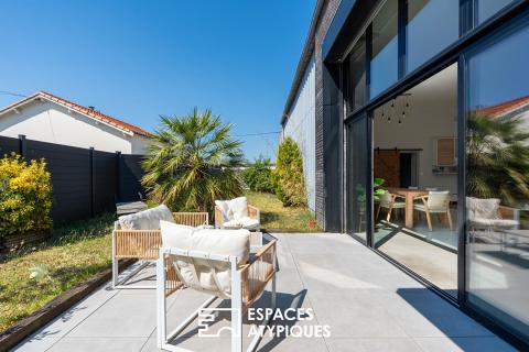 Maison familiale aux volumes généreux, jardin intimiste et architecture contemporaine