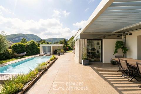 House with contemporary renovation, featuring a pool and mountain view