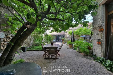 Charming village house: vaulted ceilings, secluded garden and barn to renovate