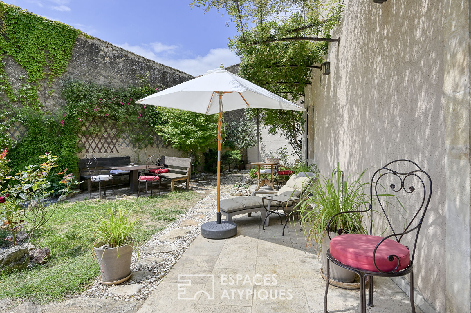Elegant hamlet house and its landscaped garden