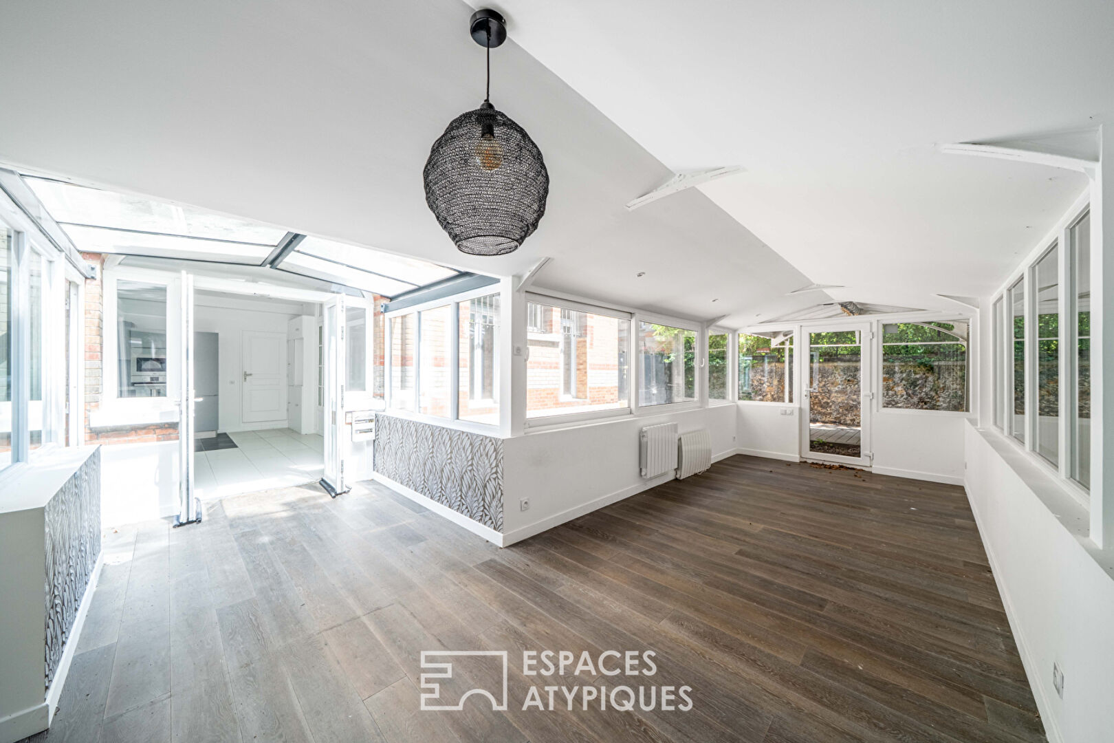 Loft avec véranda et terrasses, rue de la Colonie