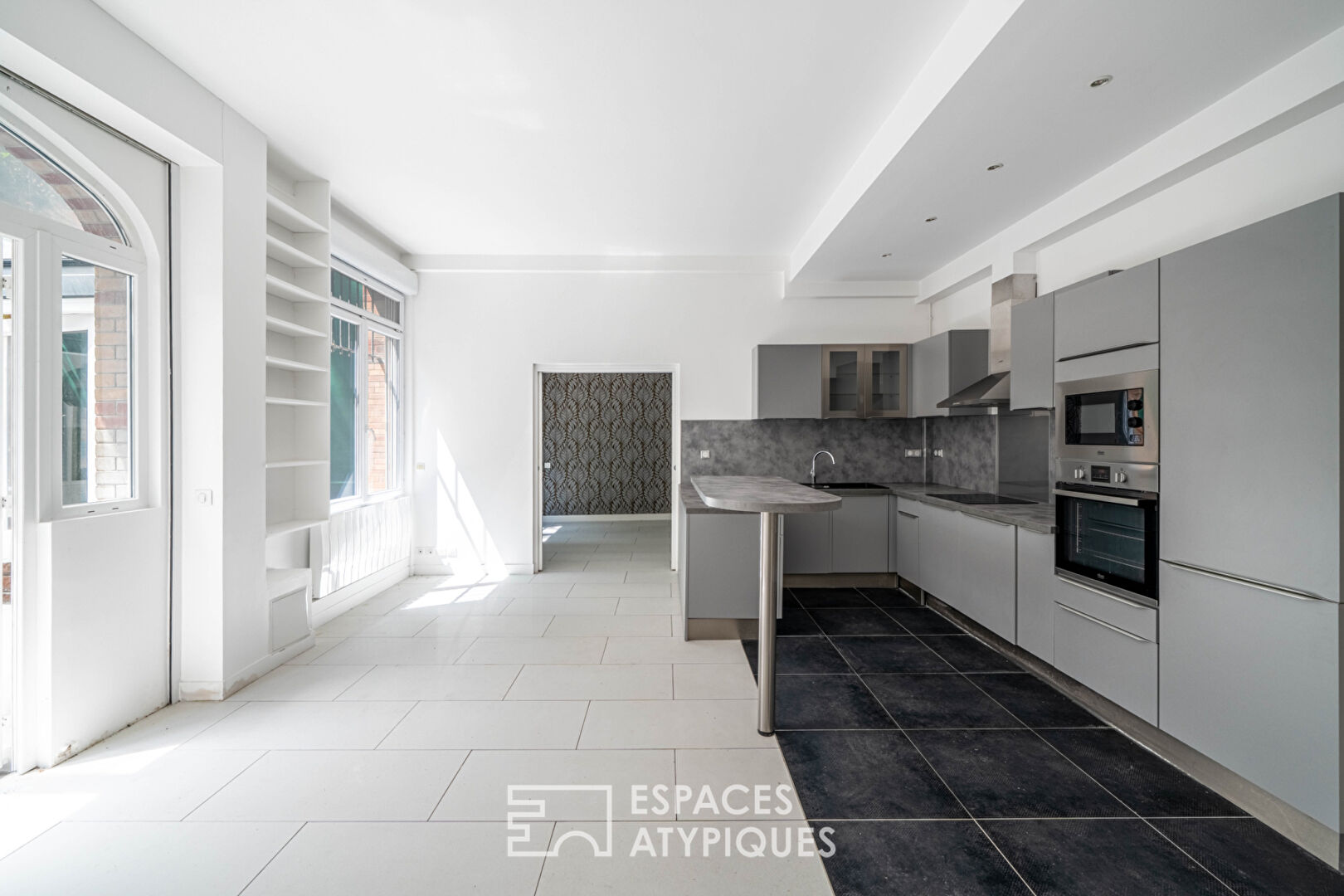 Loft avec véranda et terrasses, rue de la Colonie