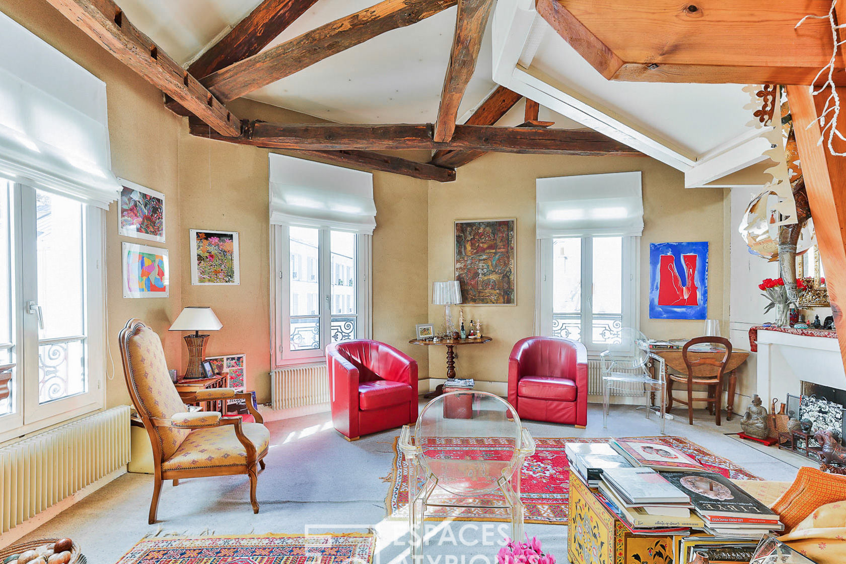 Duplex with exposed beams on the top floor