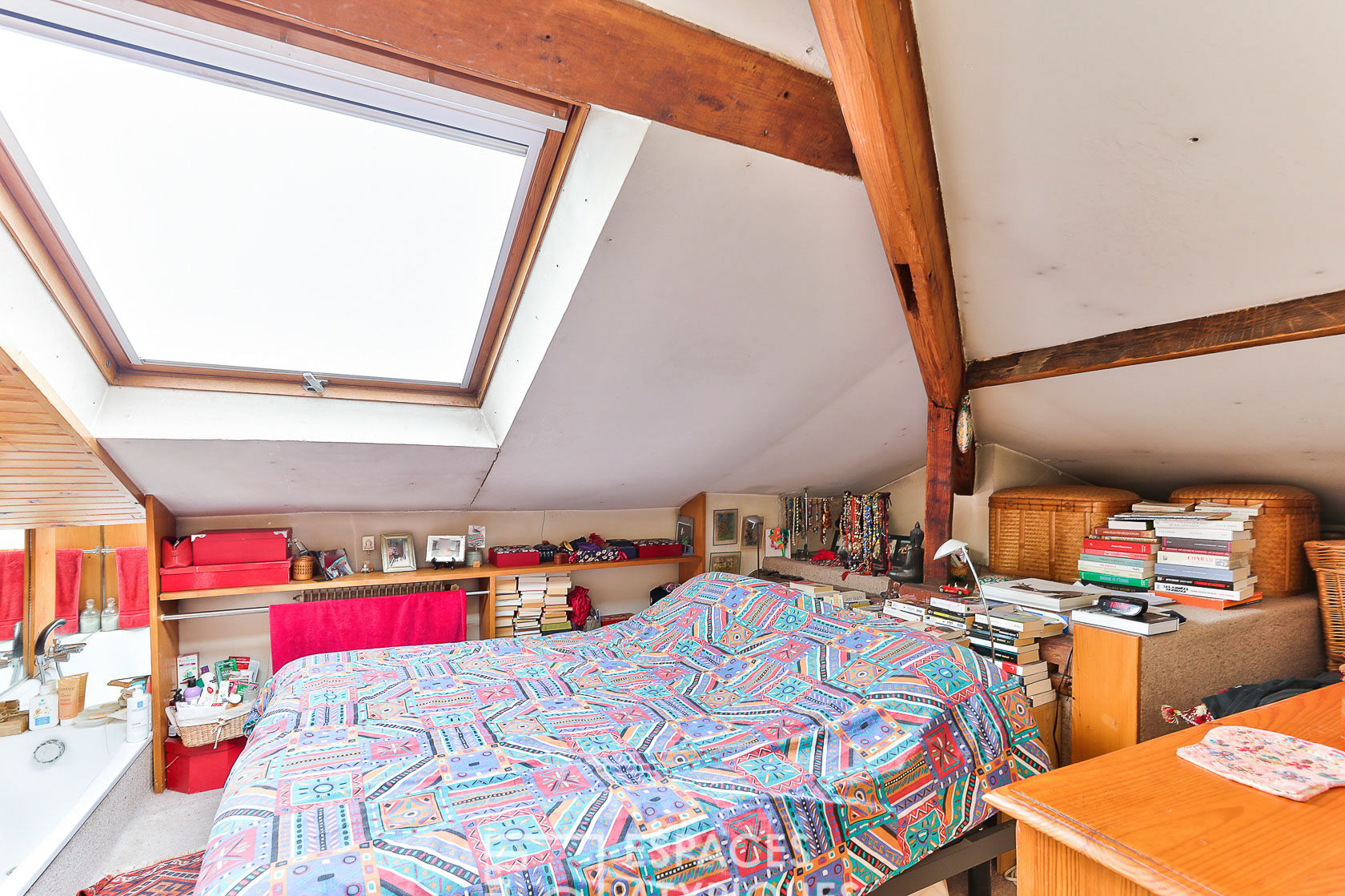Duplex with exposed beams on the top floor