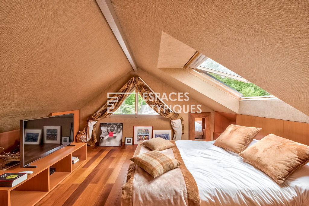 Maison avec extension en bois et jardin paysagé