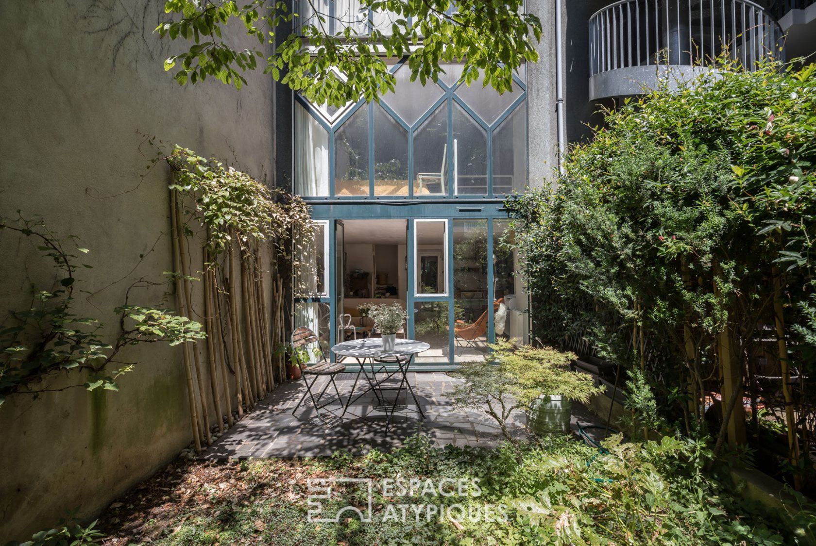 Workshop-style duplex with garden