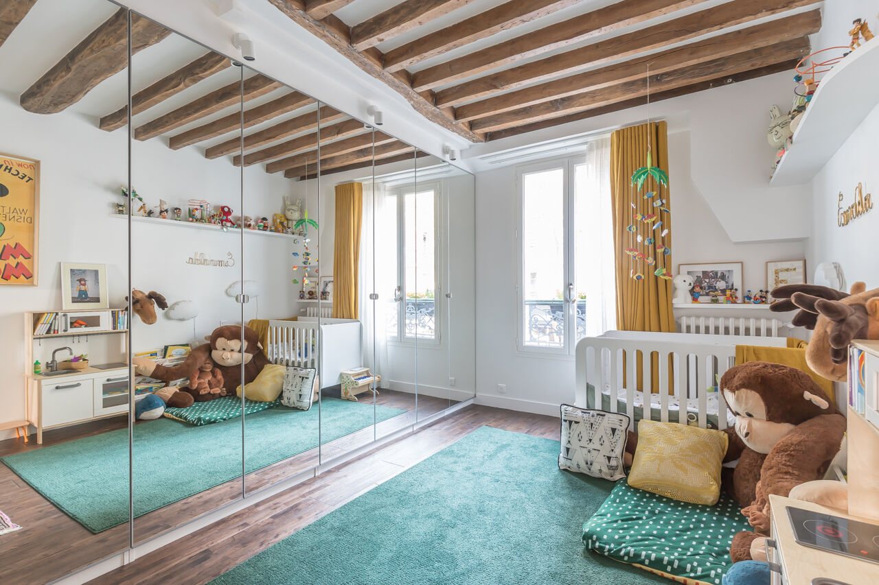 Family apartment with exposed beams