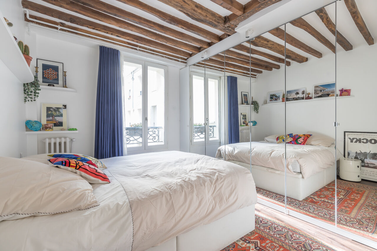 Family apartment with exposed beams