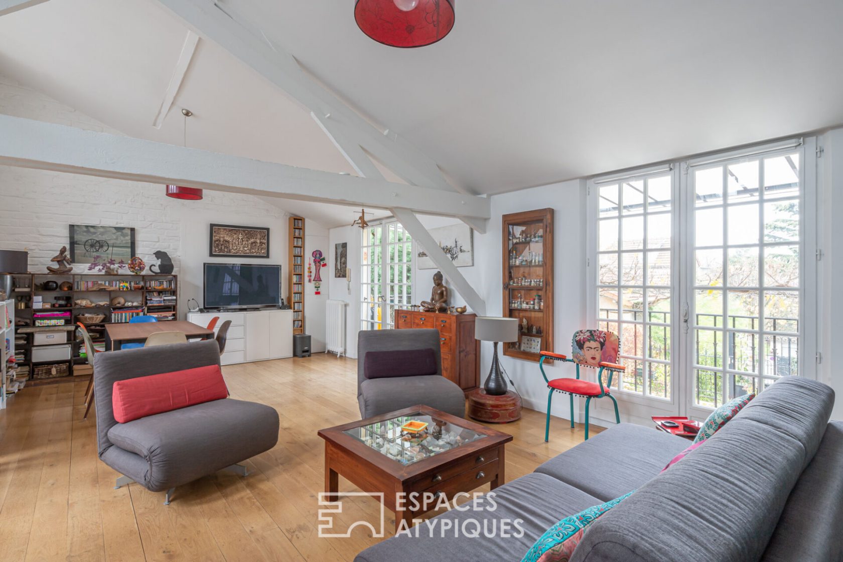 Loft with suspended terrace in a former limonaderie
