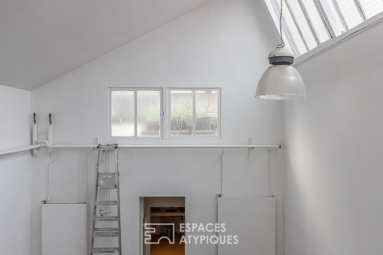 Ancien atelier avec toit terrasse