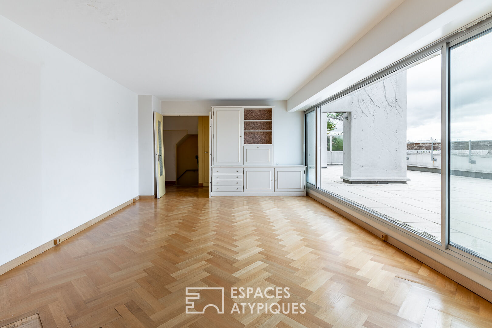 Duplex avec terrasses et jardin en dernier étage à rénover