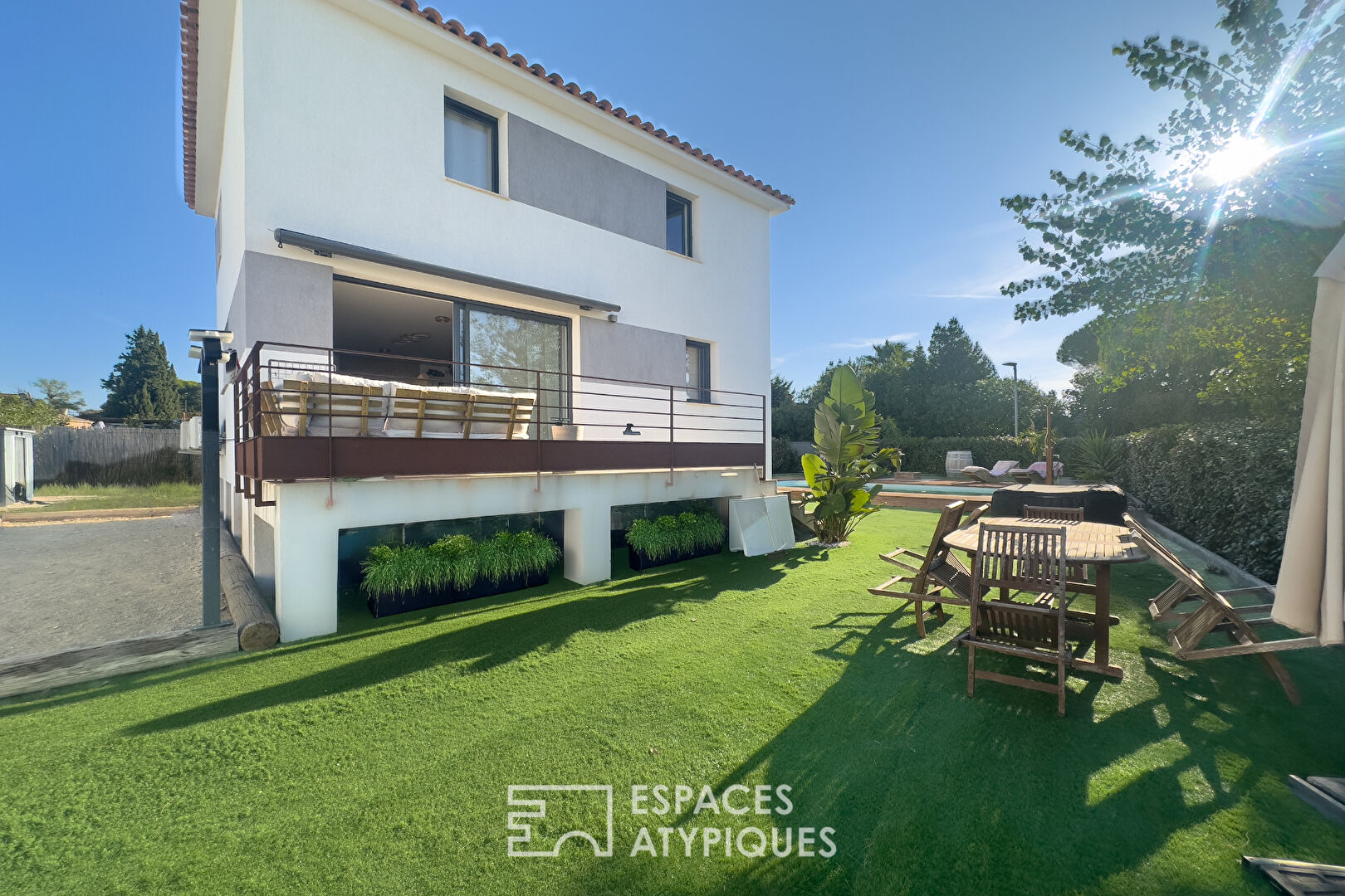 Contemporary house with swimming pool and landscaped garden
