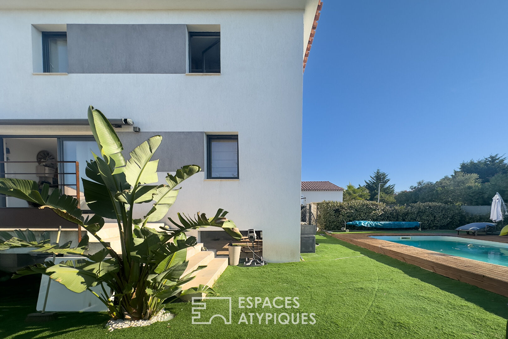 Contemporary house with swimming pool and landscaped garden