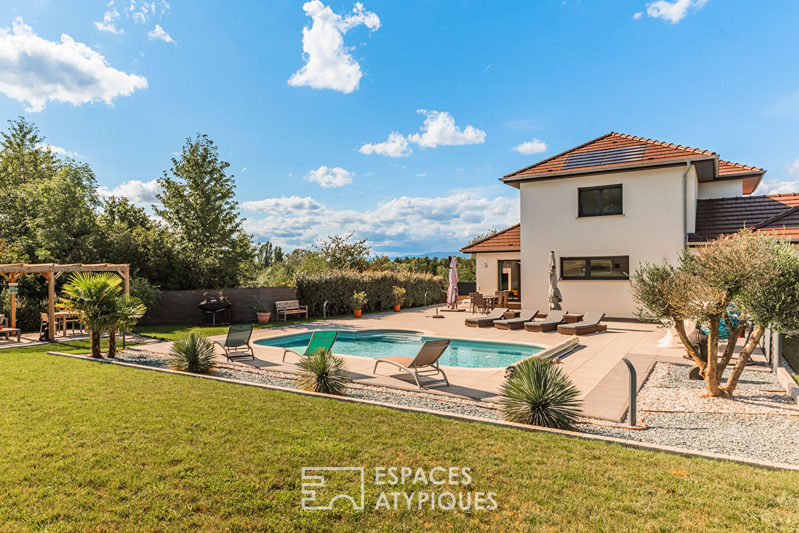 Contemporary house with swimming pool and garden