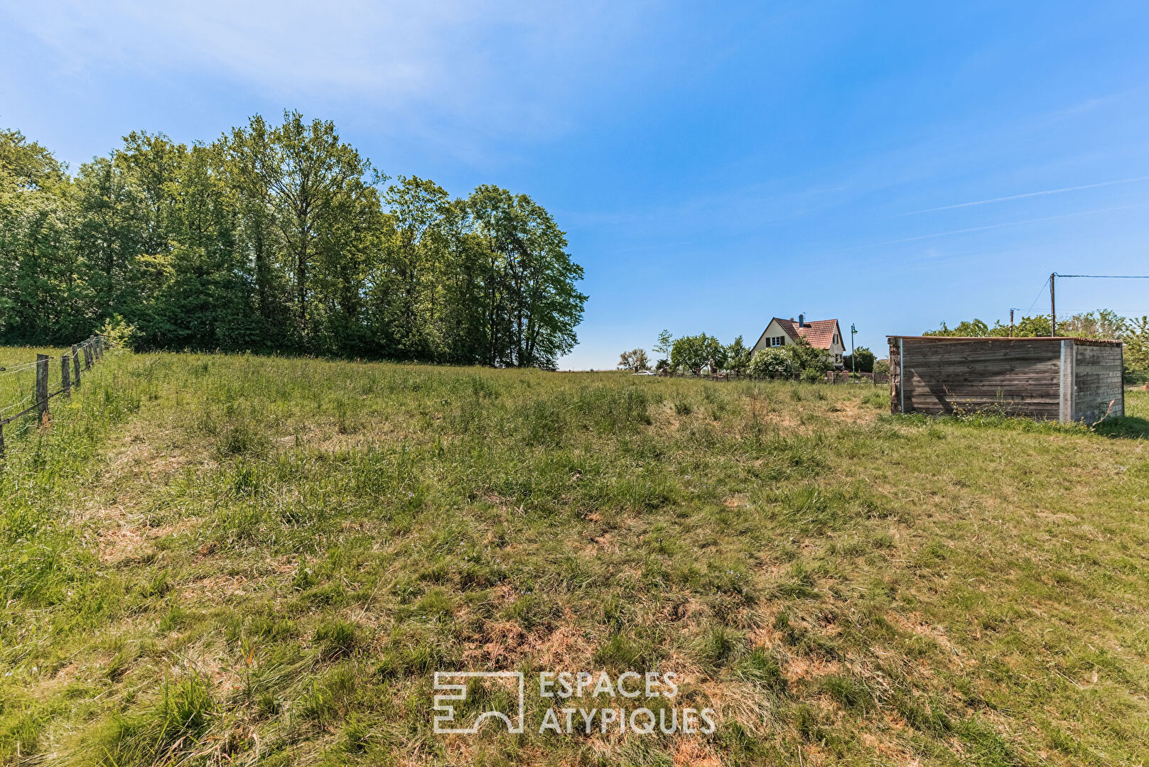 Land with a bucolic setting on the edge of the forest