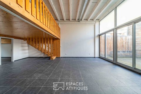 Loft et ses terrasses dans ancien supermarché